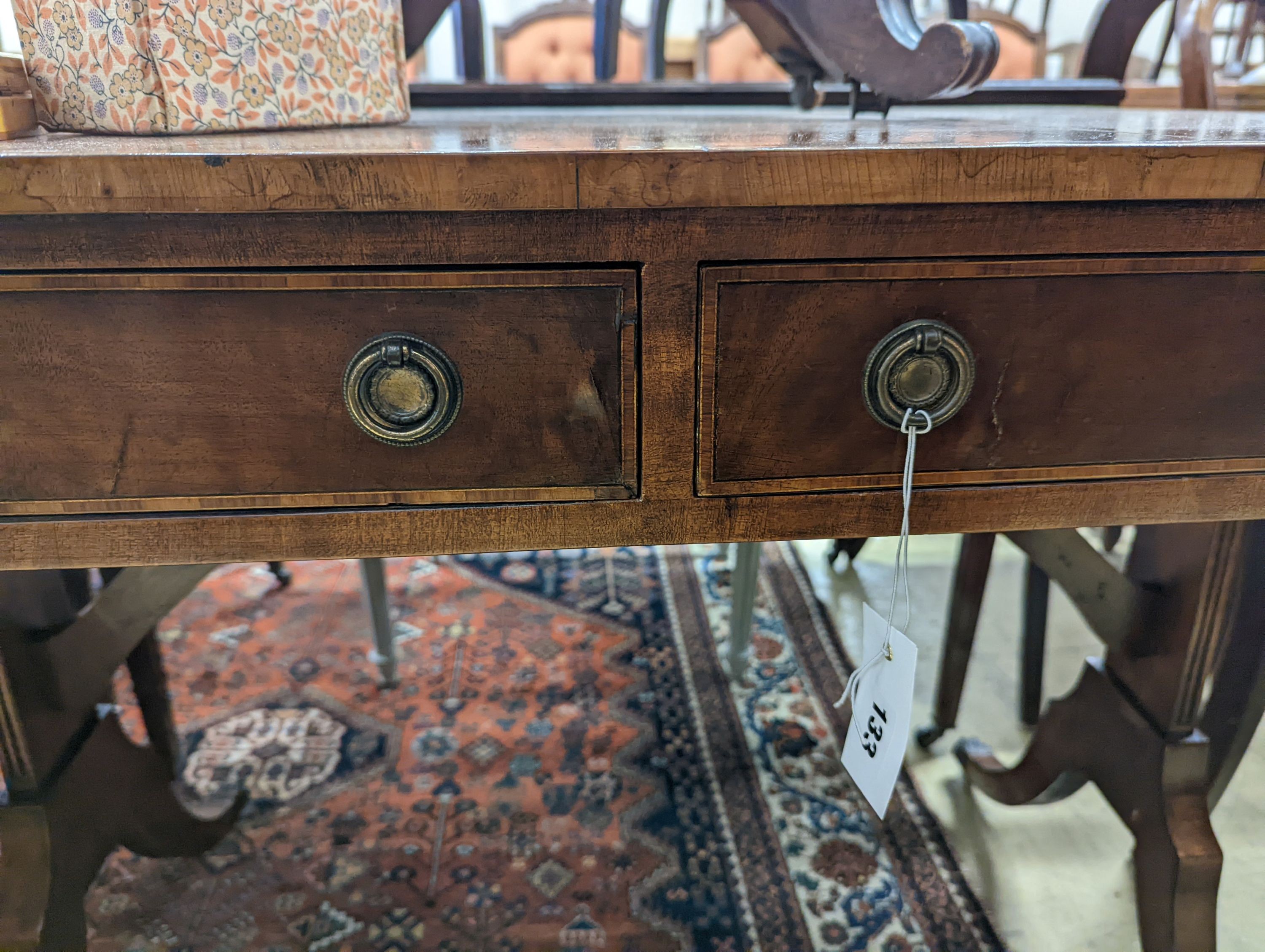 A Regency style banded mahogany sofa table, width 86cm, depth 56cm, height 72cm